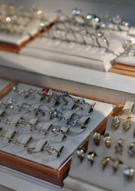 Items of jewelry in boxes in shop window